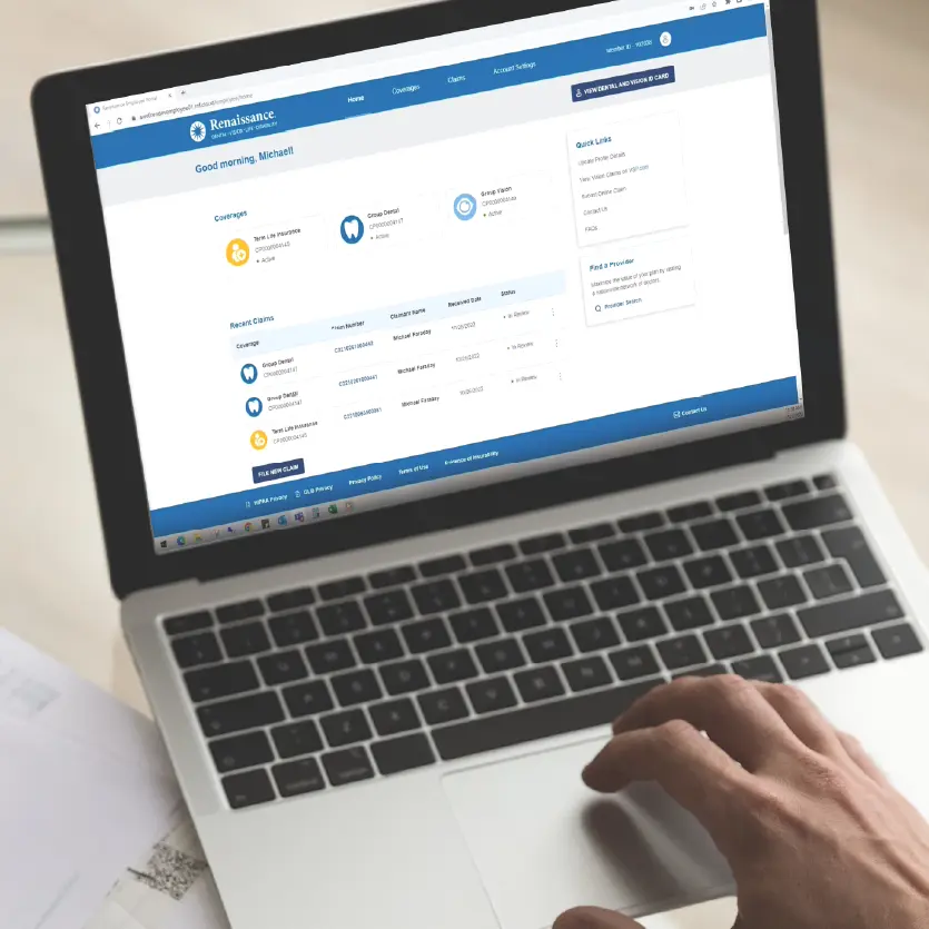Open laptop with MyRenBenefitsManager employee portal image on the screen.