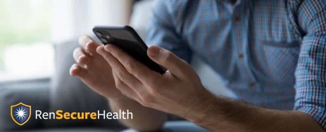 Closeup of man holding phone with RenSecureHealth logo overlayed